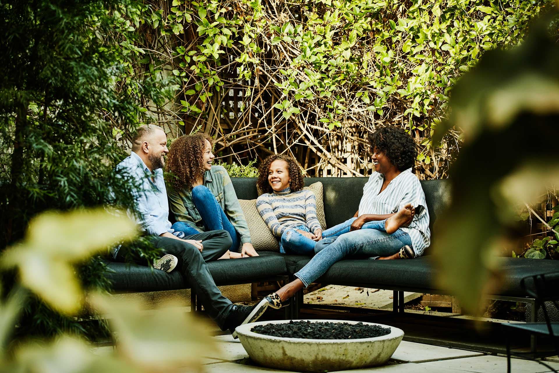 family socializing on a patio