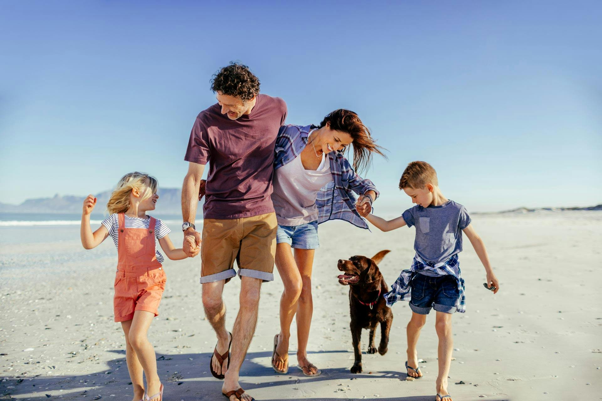 family having fun on a beach